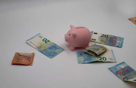 Rain of money on a piggy bankの写真素材