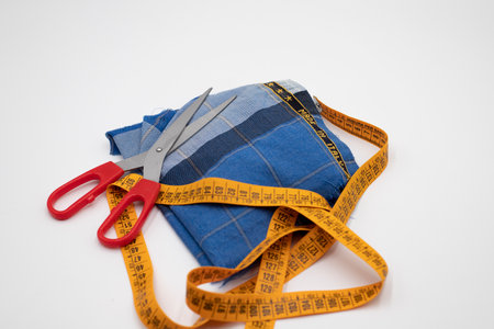 Scissors and made in Italy fabric Scissors and made in Italy fabric on white backgroundの写真素材