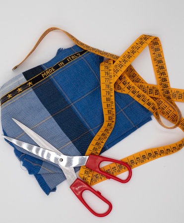 Scissors and made in Italy fabric on white backgroundの写真素材