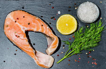 Healthy food, seafood - Steak fresh salmon with a slice of lemonの写真素材
