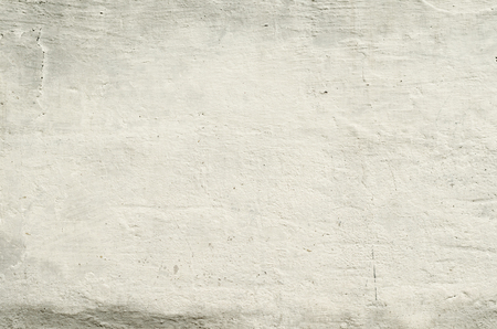 texture old concrete wall with remains of plasterの写真素材