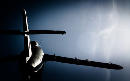 old military aircraft against the blue skyの写真素材