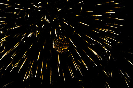 holiday flash of colorful fireworks in the black night skyの写真素材