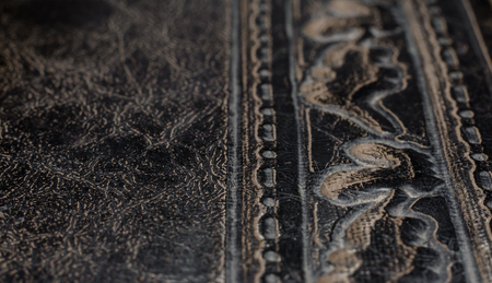fragment of leather cover of an old book macro closeupの写真素材
