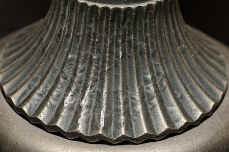 fragment of old metal candlestick macro closeupの写真素材