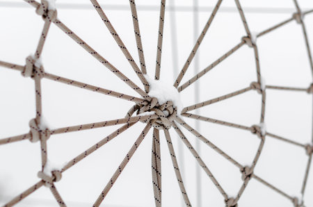 tied rope in the snow close up
