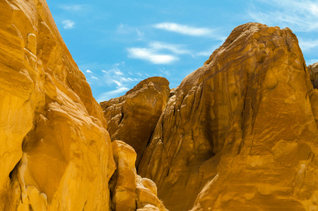 high rocky mountains against the blue sky and white clouds in the desert in Egypt Dahab South Sinaiの写真素材