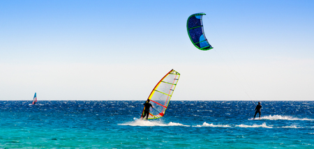 windsurfers and kitesurfers ride in the Red Sea in Egypt Dahabの写真素材