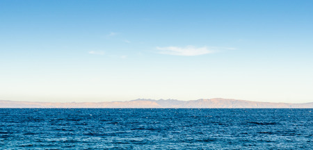seascape uninhabited rocky island in the seaの写真素材