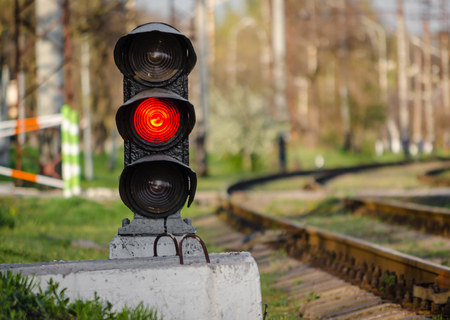 semaphore with a red signal near the railwayの写真素材