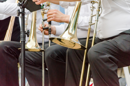 ands and trumpets of symphony orchestra musicians closeupの写真素材