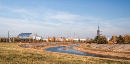 panorama of nuclear power plant with river and forest Chernobyl Ukraine in autumnの写真素材