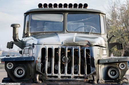 cockpit of an old damaged army military truck close upの写真素材
