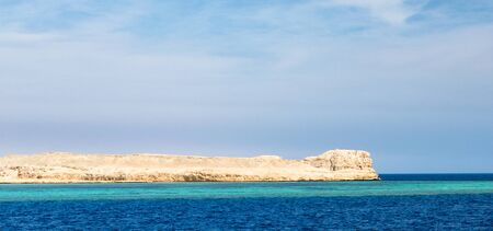 landscape rocky coast of the Red Sea and
blue sky with clouds in Sharm El Sheikh Egyptの写真素材