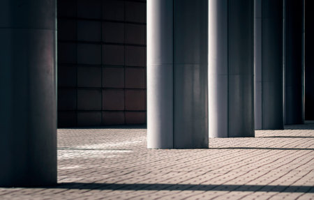columns of a modern building on a city street without people architectural backgroundの写真素材