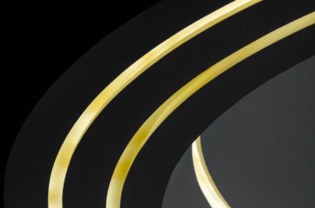 part of a modern building with lighting abstract background shades of gray and yellow curved linesの写真素材