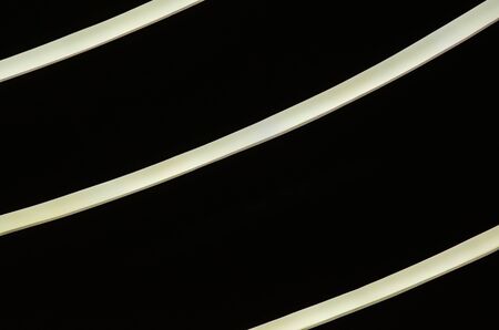part of a modern building with lighting abstract background yellow curved linesの写真素材