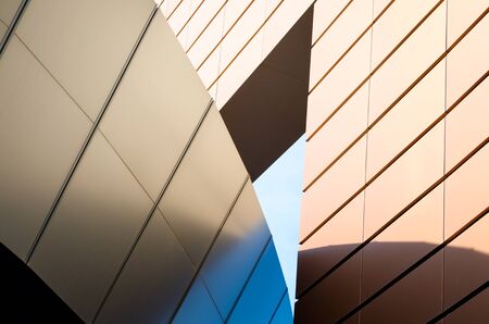 tall orange modern building architectural abstract background patternの写真素材