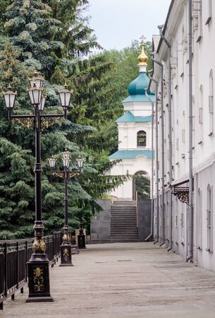 bottom view domes of christian church with crosses on blue sky background in Ukraineの写真素材