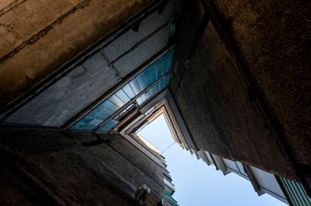 old gray tall building without people in Ukraine Donbass bottom viewの写真素材