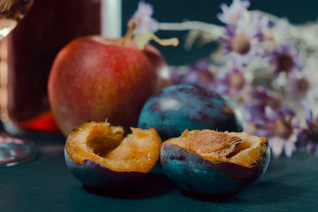 ripe apple and plum on the kitchen table harvest autumnの写真素材