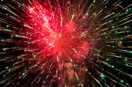 festive fireworks in the night black sky abstract background patternの写真素材
