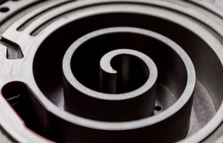 metal spiral part mechanism industrial background close upの写真素材