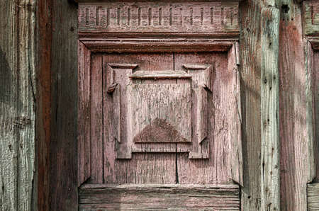 old wooden wall of vintage house with decor close upの写真素材