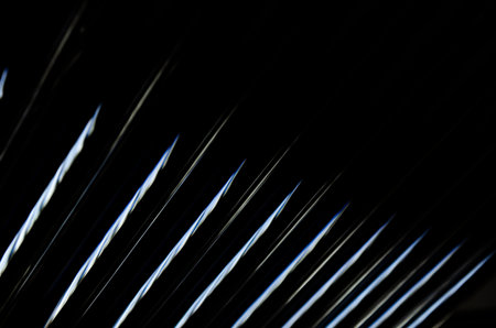 abstract dark black background with shiny metallic lines pattern