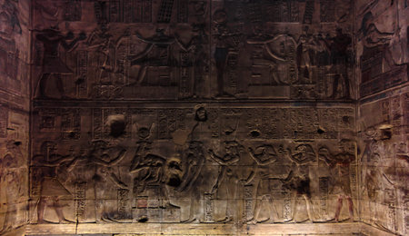 Ancient Egyptian hieroglyphs on the wall in Luxor in Egypt pattern background