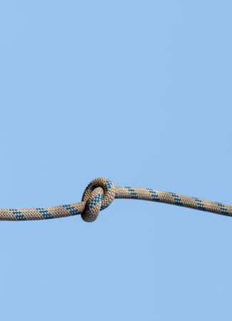 knot on a rope on a blue background close up