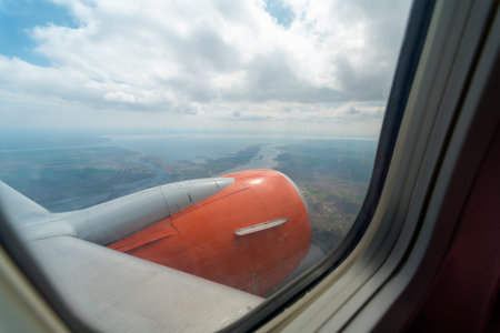 view from the airplane window of the airport during takeoff close up