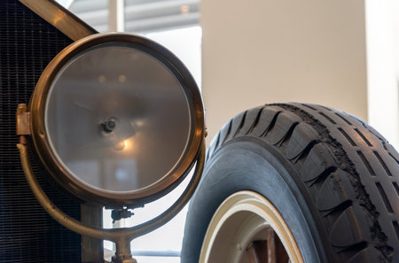 retro car wheel and headlight close upの写真素材