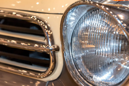 radiator grille and headlight of retro car close up