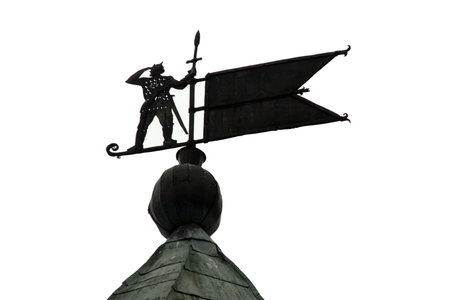 a windvane on a roofの写真素材