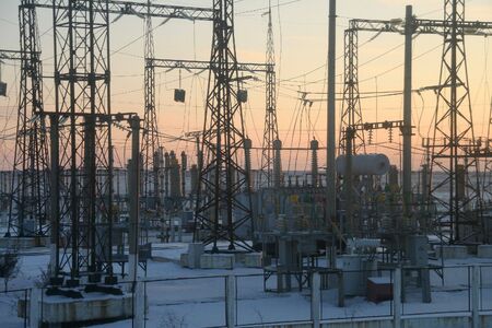 high-voltage, distribution substation on a sunsetの写真素材