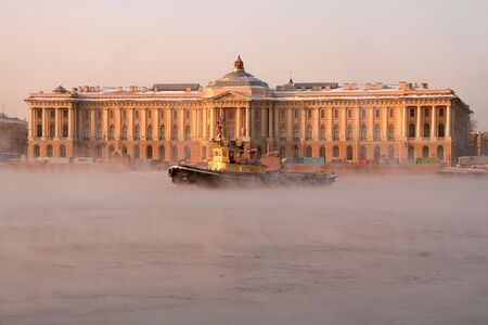 a small yellow ice breaker on a riverの写真素材