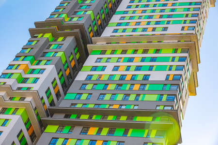 Facade of the new residential high-rise buildings against the skyの写真素材