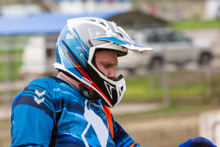 Close up view bikers face in helmet. Closeup portrait of a man in motorcycle helmetの写真素材