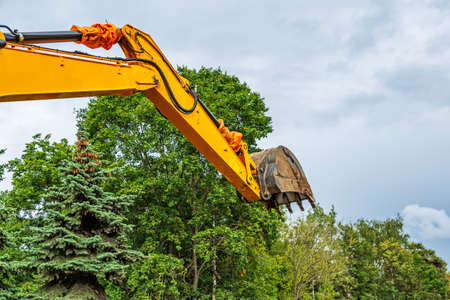 excavator in city during earthmoving worksの写真素材