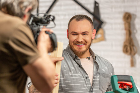 Behind the scenes of production for camera equipment video shooting, the set scene with the worker
