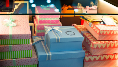 Various colorful gift boxes on display in store.