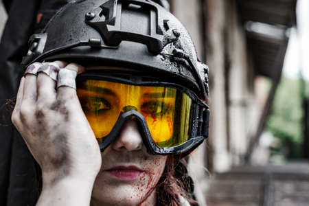 Powerful Woman Holding Gun. War Action Movie Style. Close upの写真素材