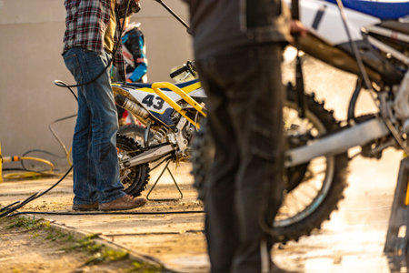 Bike rider washing his motorcycle