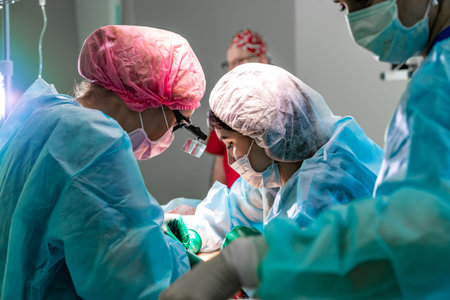Surgeons team working with patient. breast augmentationの写真素材