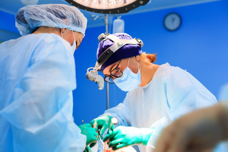 Surgeons operating a patient in operating room
