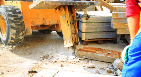 Tractor with hydraulic hammerの写真素材