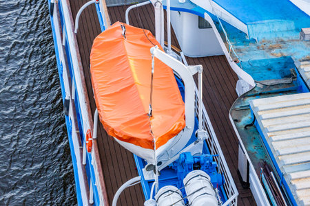the lifeboat is fixed on a white ship