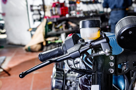 Detail on a modern motorcycle in the workshope. Motorcycle Exhaust. selective focus