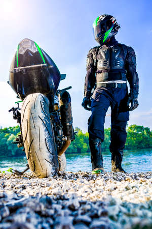 Motocross racers on landscapeの写真素材